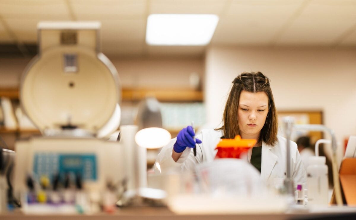 student working in a clinical lab setting