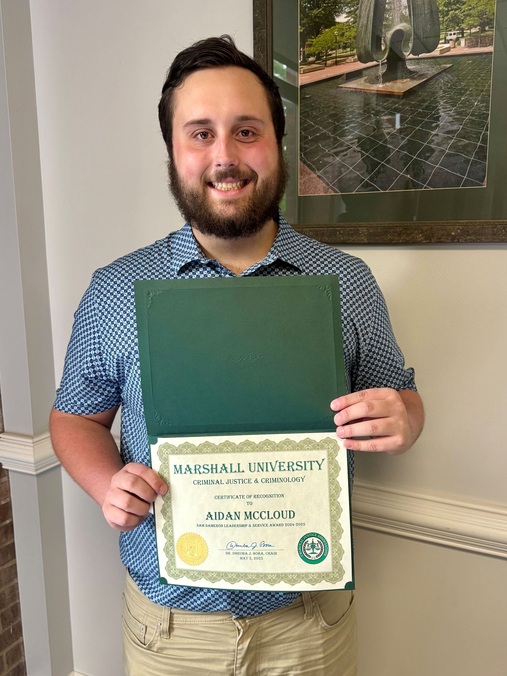 Aidan McCloud with a certificate