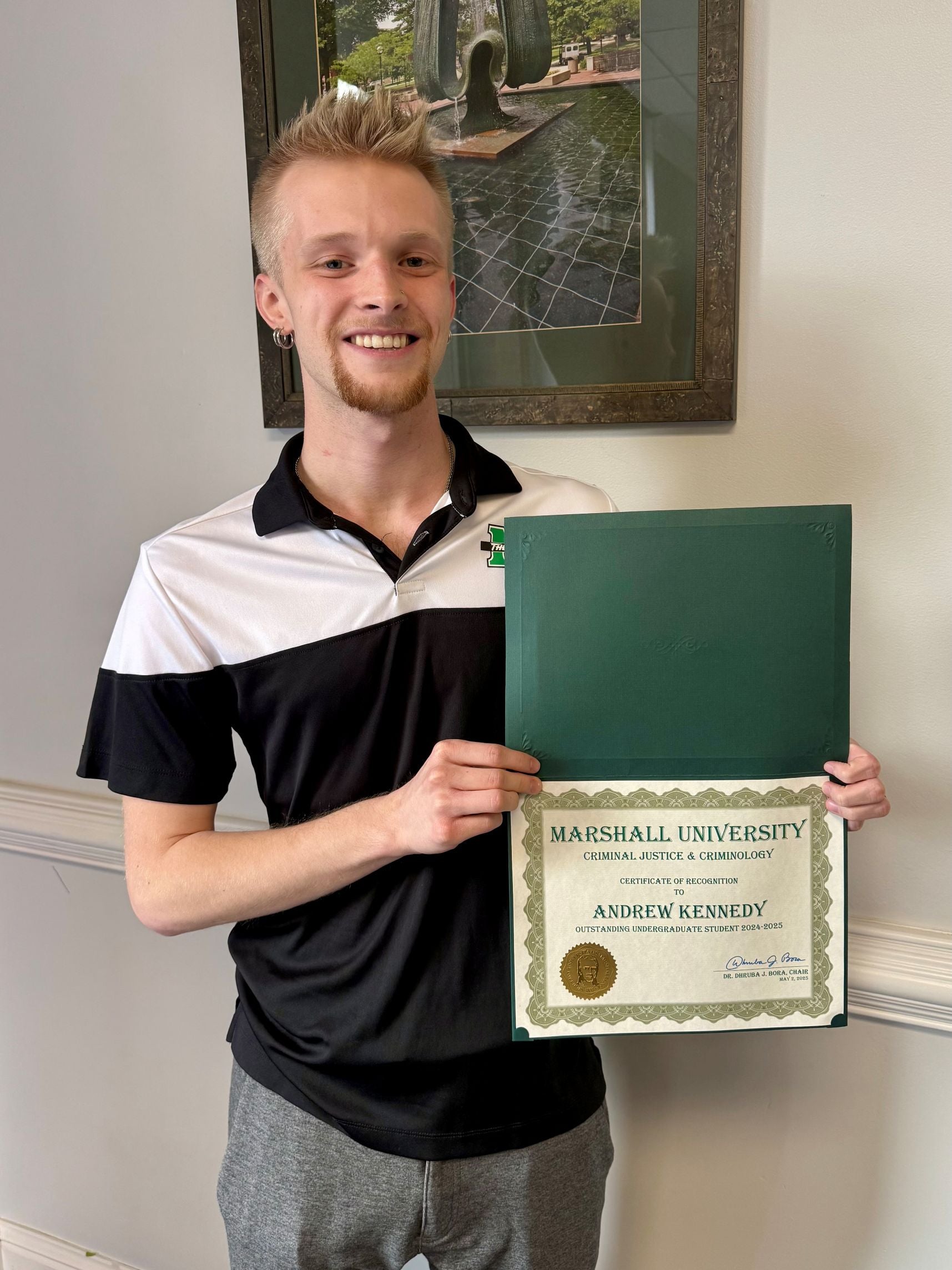 Andrew Kennedy with a certificate