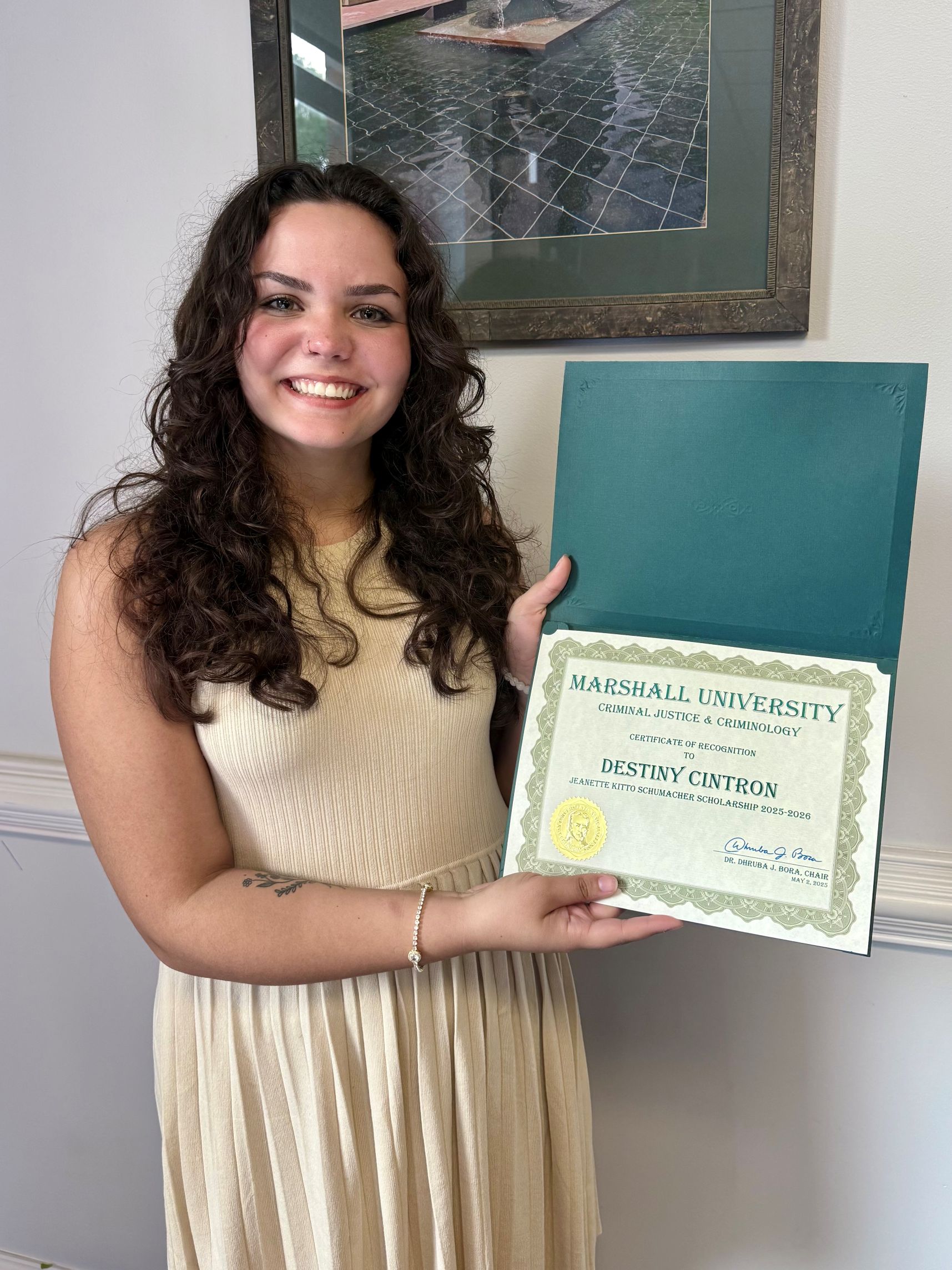 Destiny Cintron with a certificate