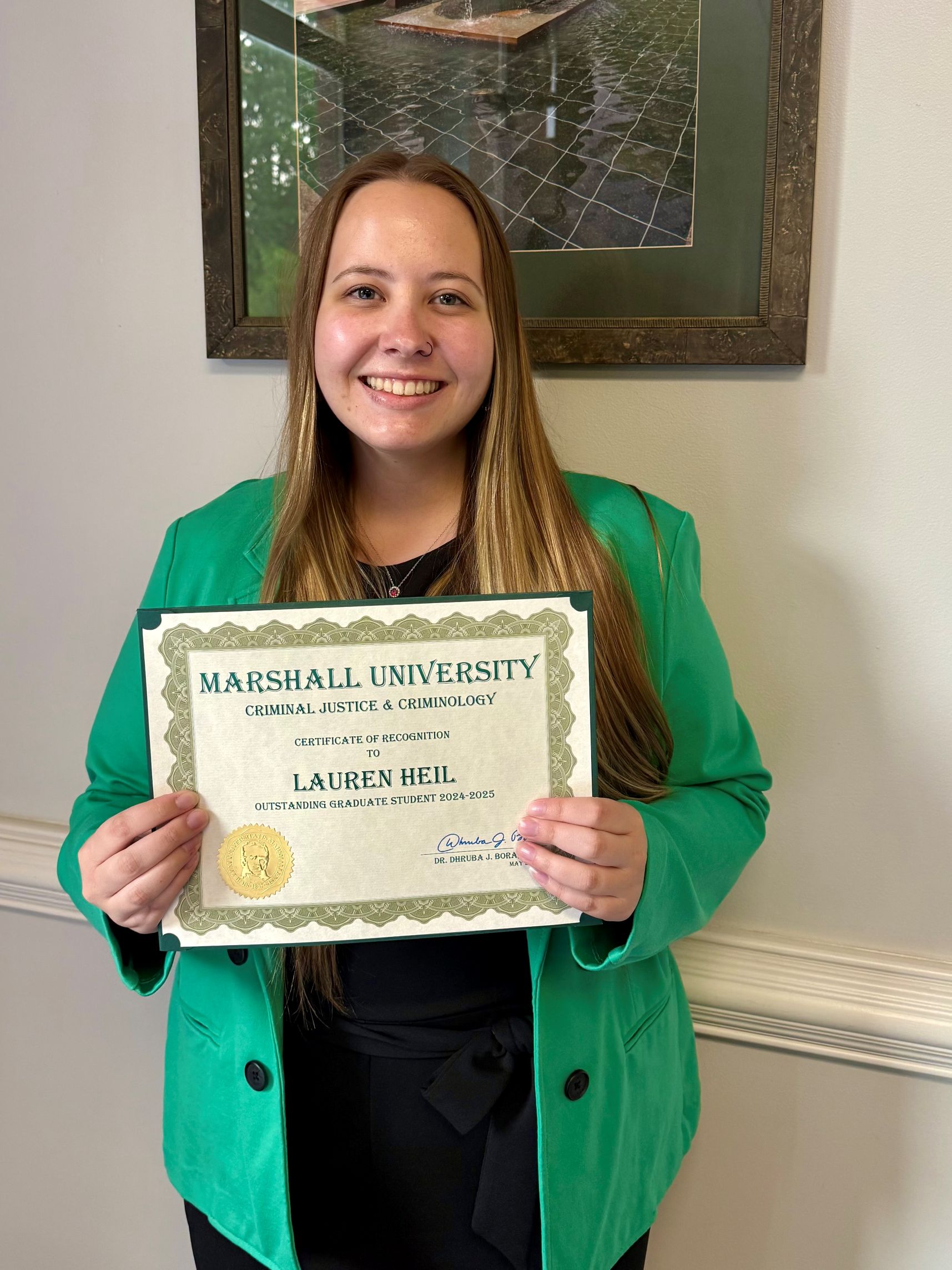 Lauren Heil with a certificate