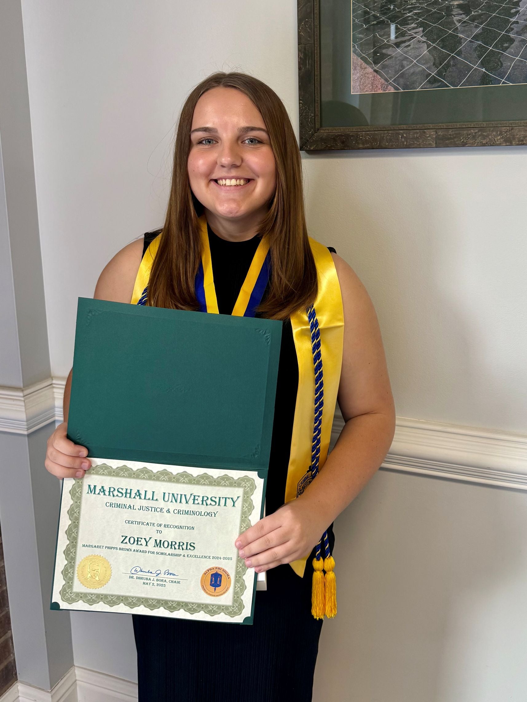 Zoey Morris with a certificate