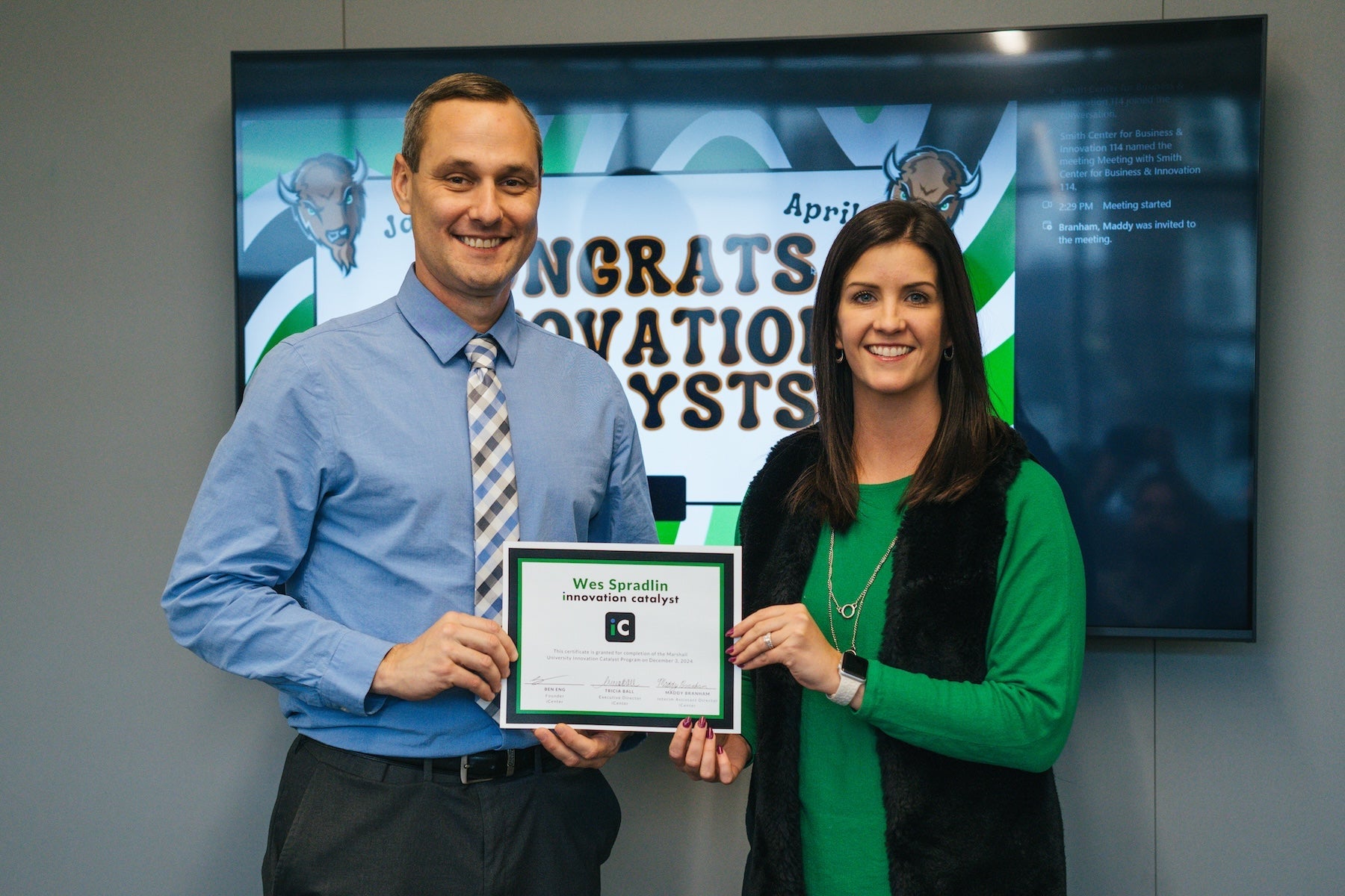 Wes Spradlin receiving a certificate from Tricia Ball