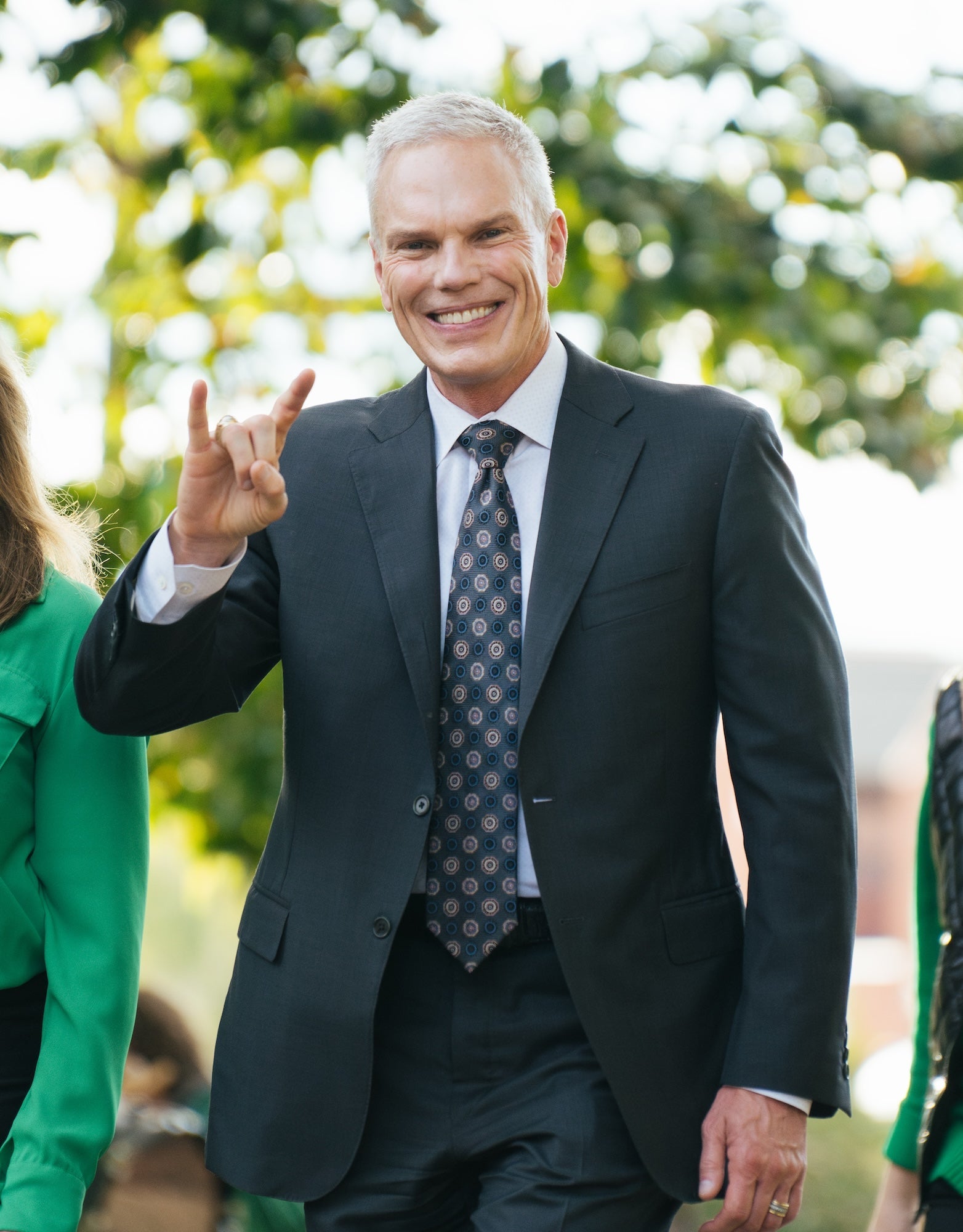 Brad D. Smith showing the Go Herd sign with his hands