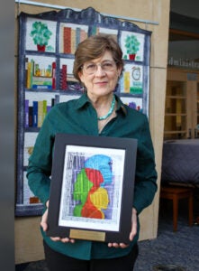 Montserrat Miller receiving her award