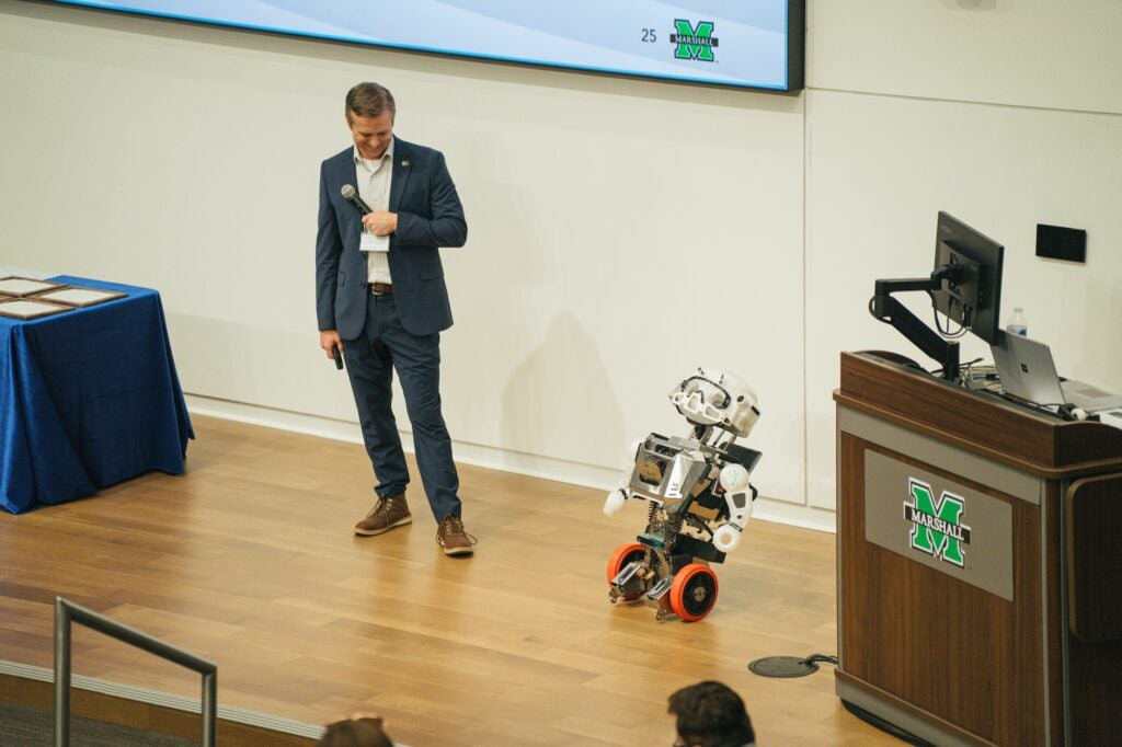 Brandon Dennison presentation with robot