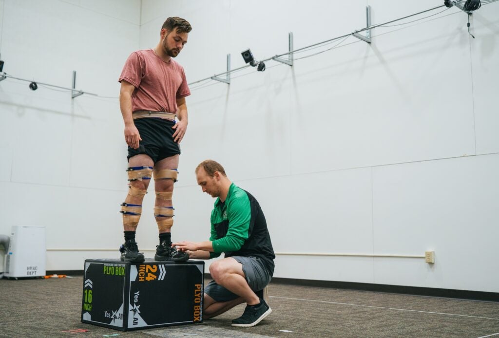 two students working in exercise science lab