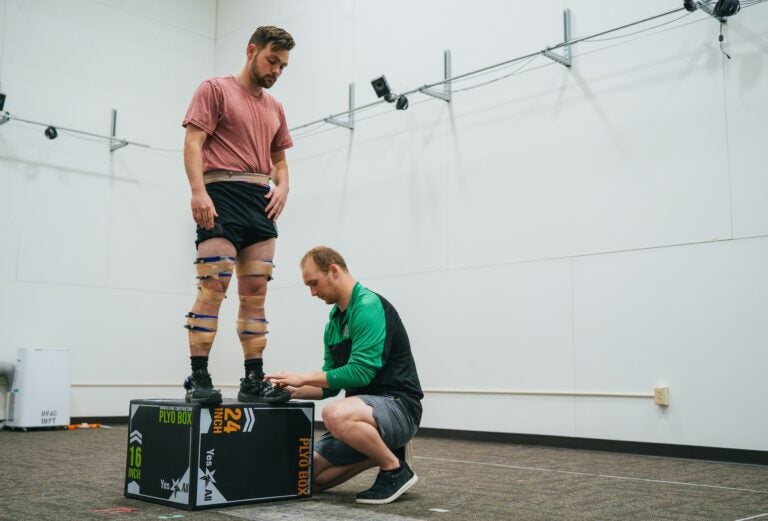 two students working in exercise science lab